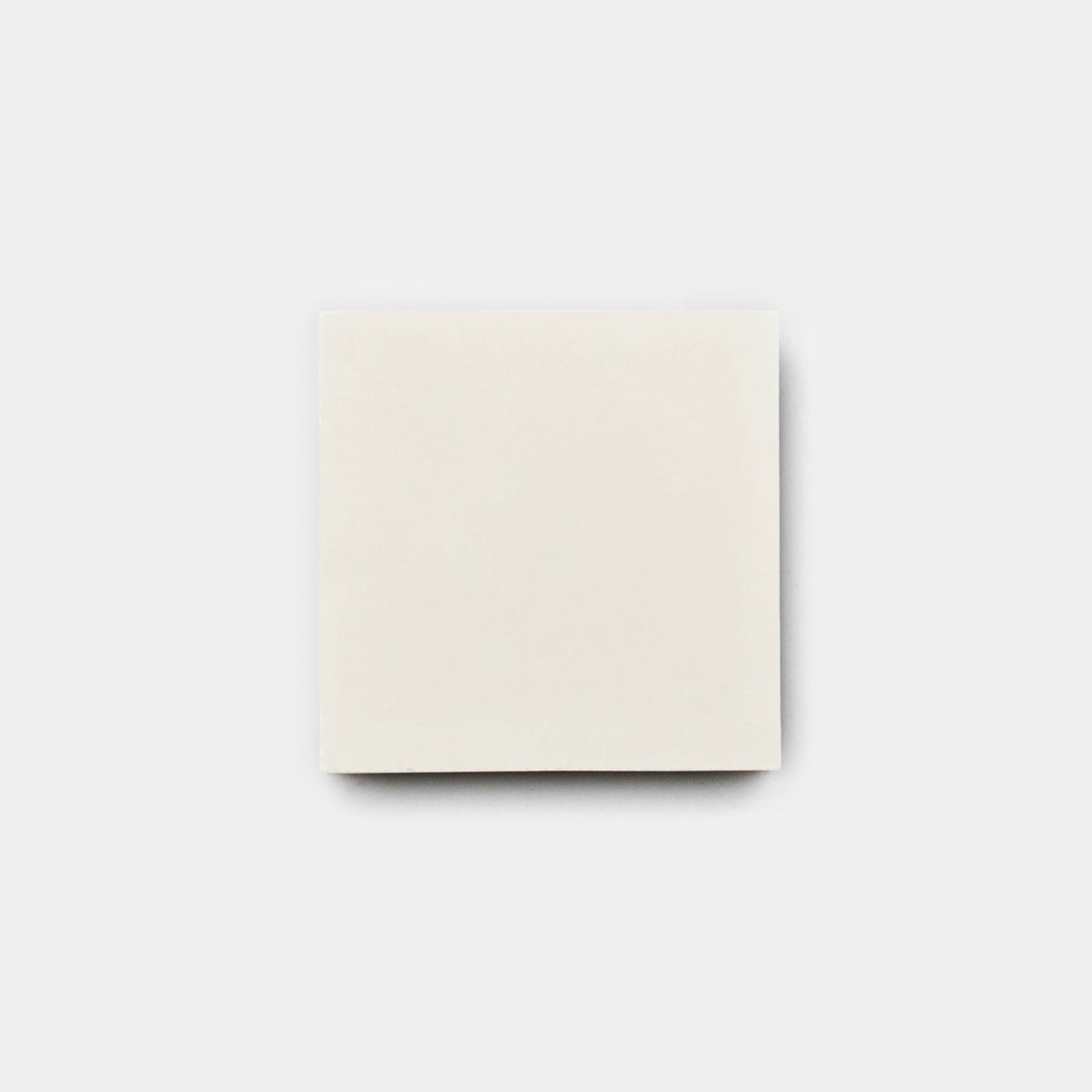 The Cotton 4x4, Sample by vendor-unknown is a plain white square bar of soap on a light gray background, evoking the clean lines and subtle elegance of a handmade tile.