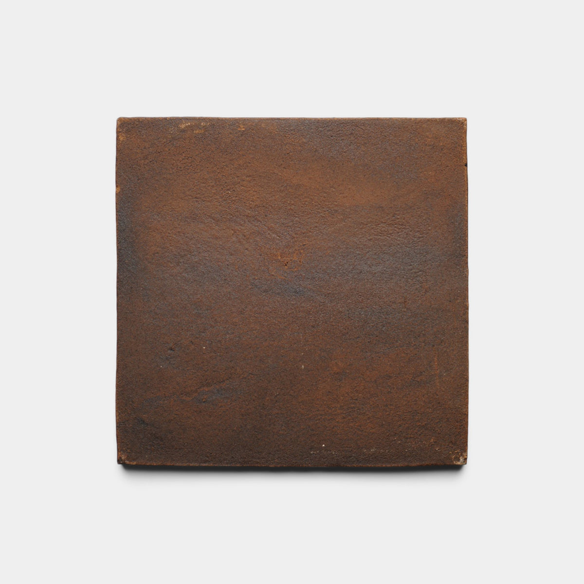 A single 8x8 Square + Madera tile sample by Zia Tile, featuring a rustic brown hue, textured matte surface, and slightly uneven edges, displayed against a plain white background.