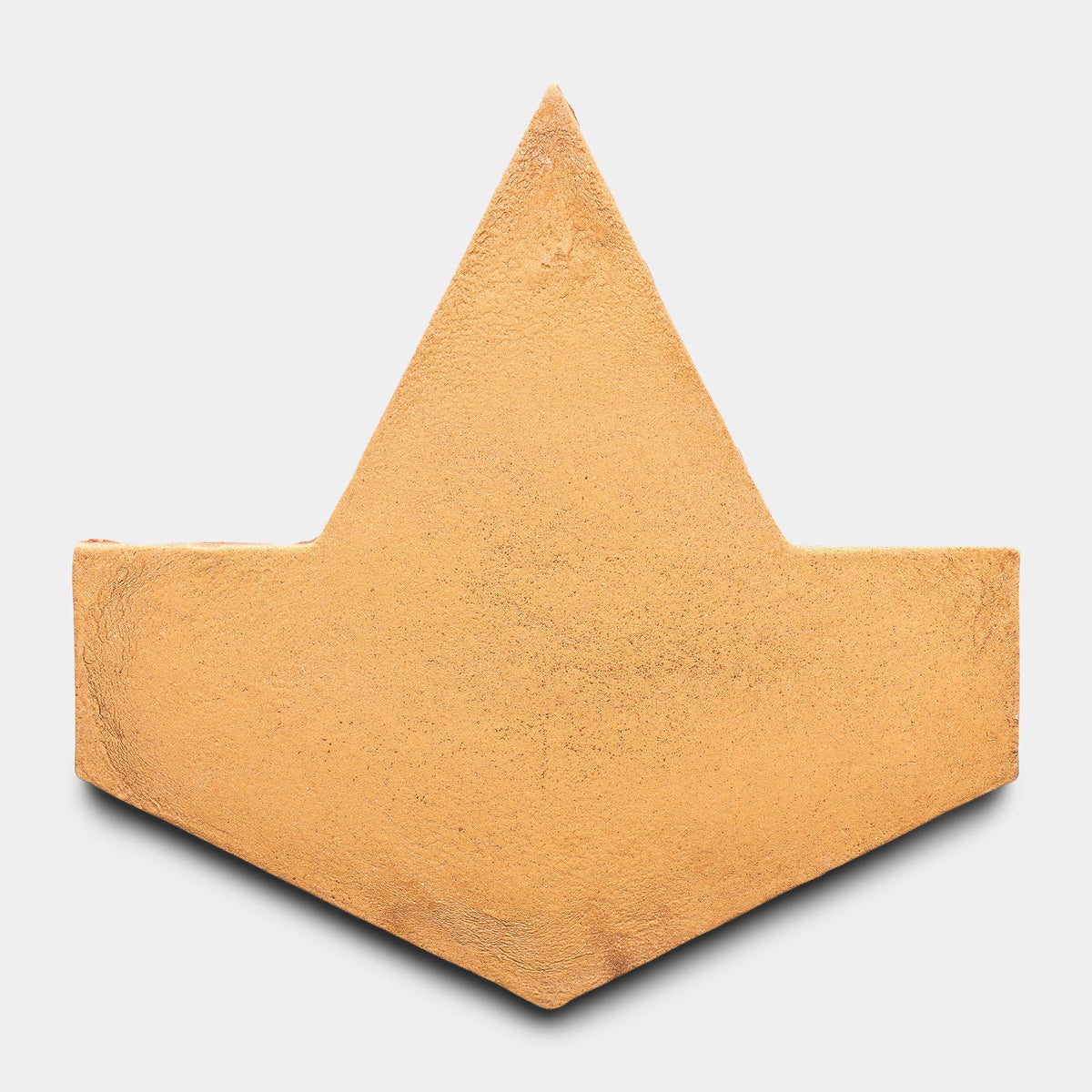 The Big Alcazar + Adobe Sample by Zia Tile is a gold-textured, paper boat hat-shaped piece with a pointed top and flared sides, shown on a plain white background.