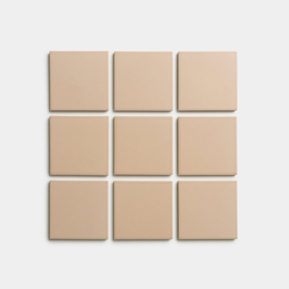 Nine Afterglow 4x4 tiles by Zia Tile, beige and square, arranged in a 3x3 grid on a white background.