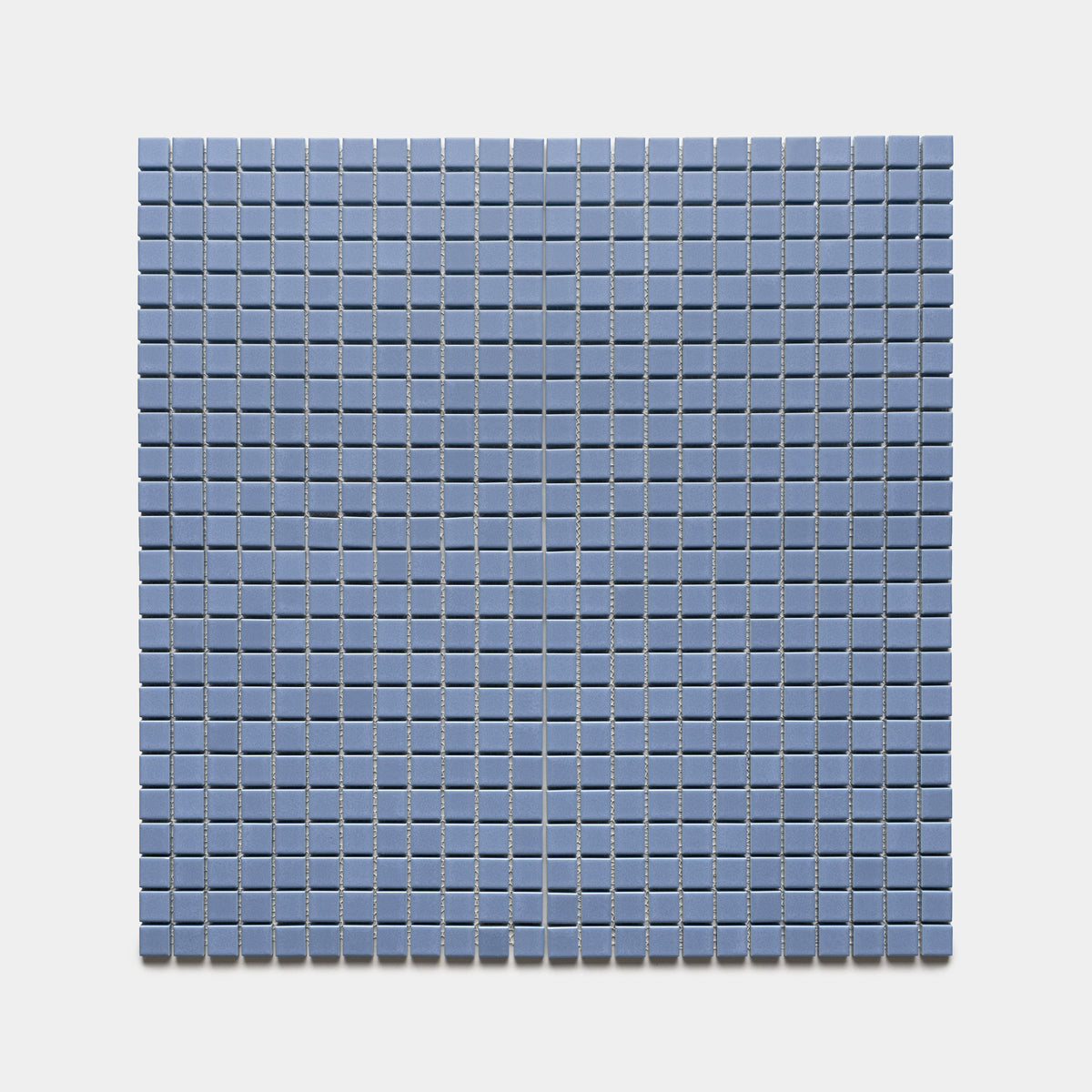 Aizome 1x1 by Zia Tile features a rectangular grid of small, square, blue tiles arranged in neat rows and columns on a light background.