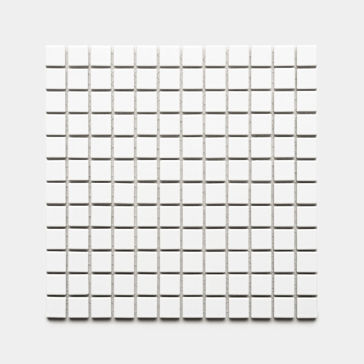 The Alabaster White 1x1 by Zia Tile features a square grid of small, evenly spaced white tiles arranged in rows and columns on a light gray background.