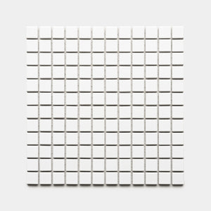 The Alabaster White 1x1 by Zia Tile features a square grid of small, evenly spaced white tiles arranged in rows and columns on a light gray background.