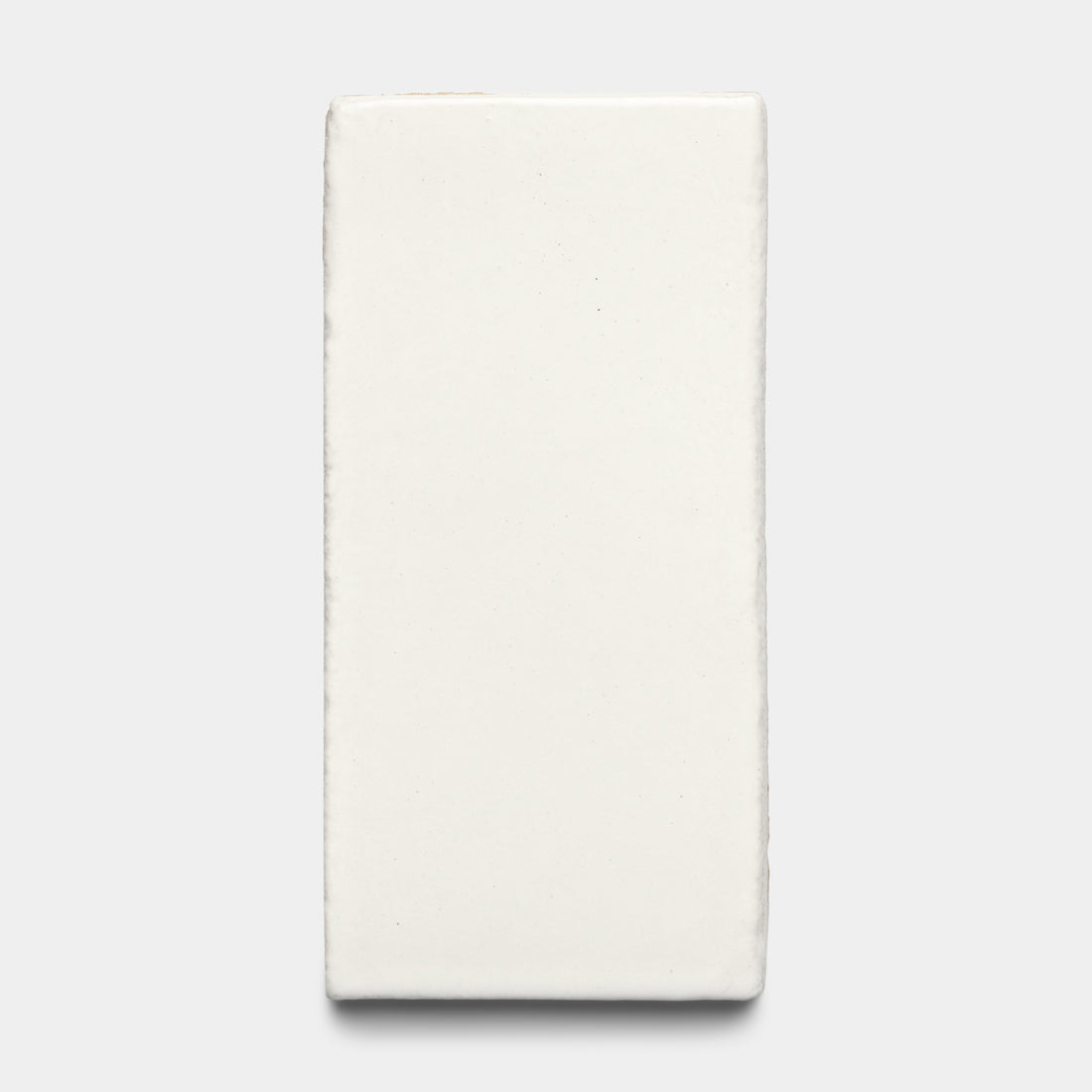 The Albar 4x8 Rectangle by Zia Tile is a rectangular off-white ceramic tile with subtly uneven edges, shown on a plain light gray background.