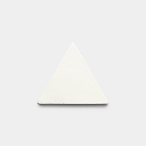 The Albar Triangle by Zia Tile, a white solid equilateral triangle, is centered on a plain light gray background.