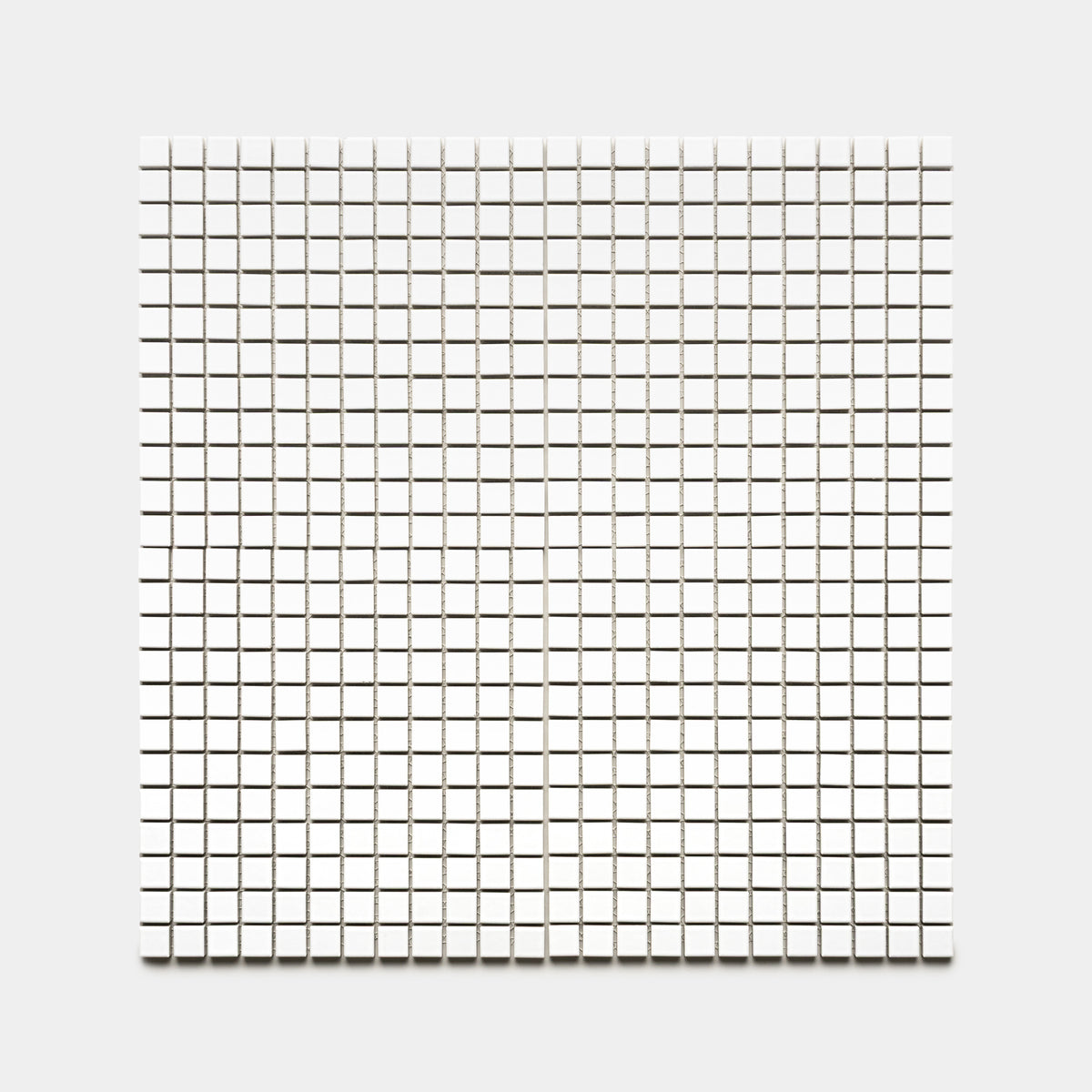 Alpha White 1x1 by Zia Tile features small white square tiles arranged in an evenly spaced grid, forming a minimalist geometric pattern on a white background.