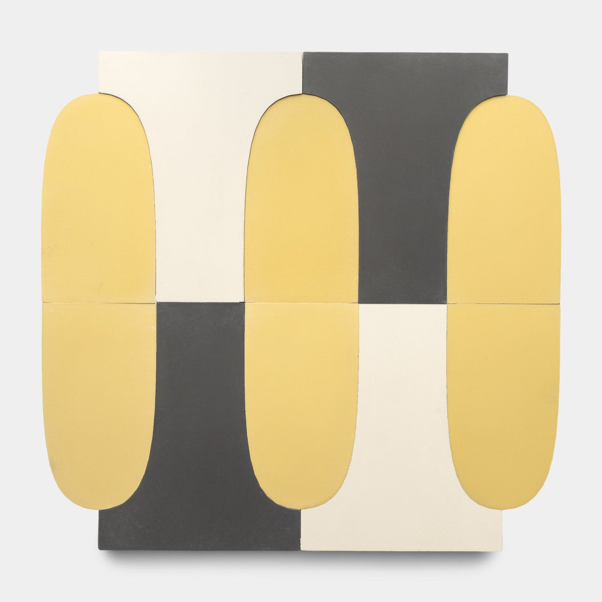 Arco Bone + Black + Mustard, Sample by Zia Tile features abstract geometric shapes in yellow, white, and dark gray. Inspired by handmade tile patterns, its symmetrical design brings a modern touch to any light background.