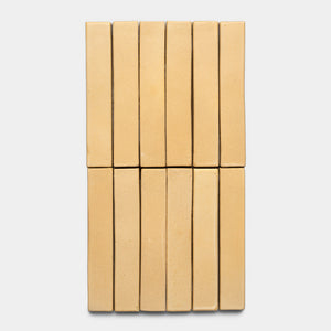 Twelve Arroyo Mini Bar cookies by Zia Tile, rectangular and beige, arranged in two rows of six on a plain white background.