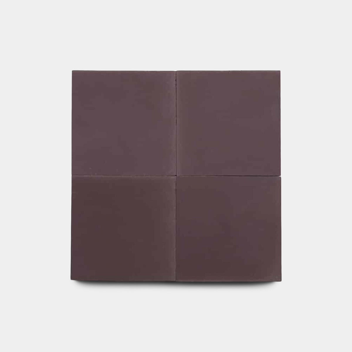 The Aubergine 4x4 Sample by Zia Tile features four equal squares arranged in a 2x2 grid, resembling handmade tile, displayed on a plain light gray background.