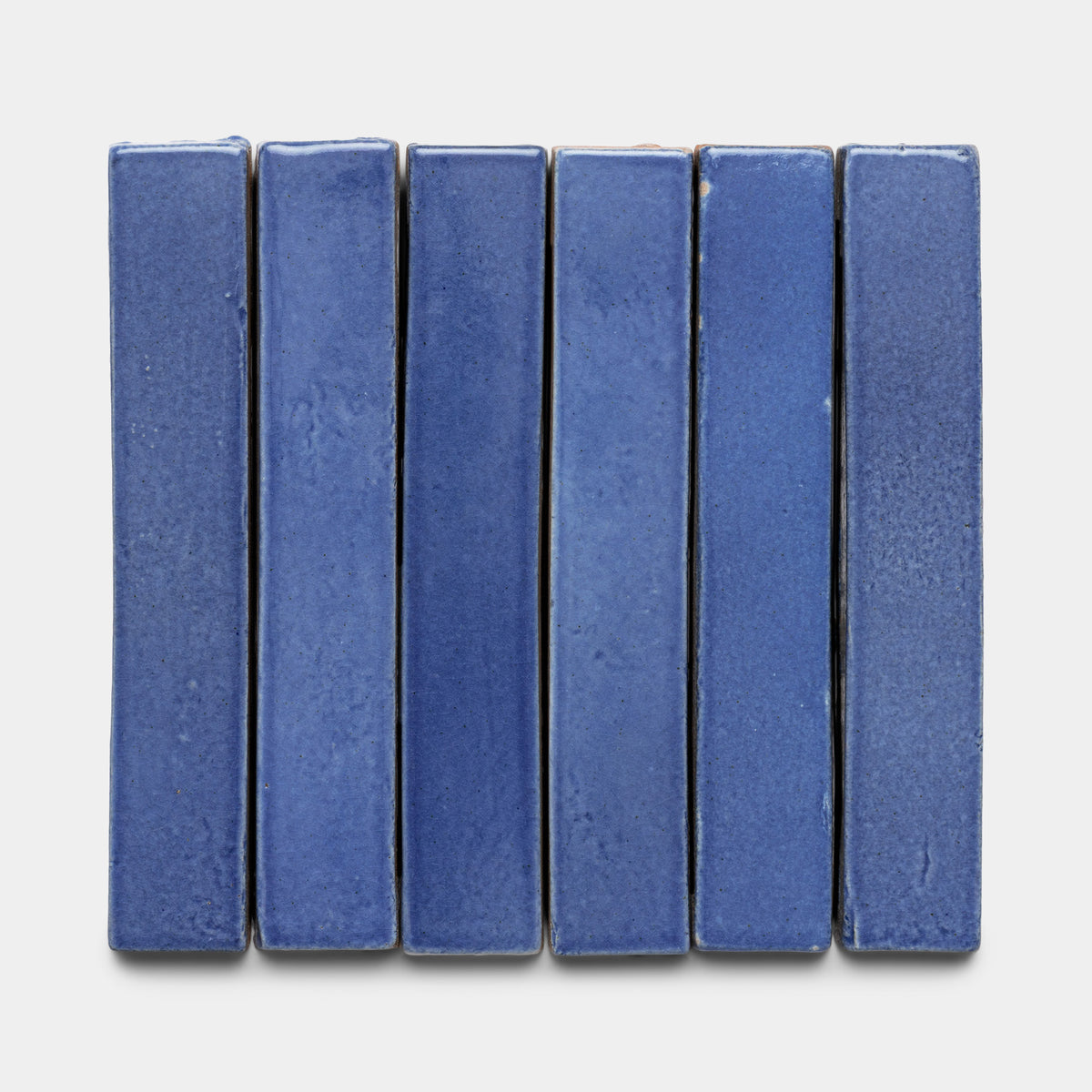 Six Azul Mini Bar tiles by Zia Tile are arranged vertically in a row against a plain white background.