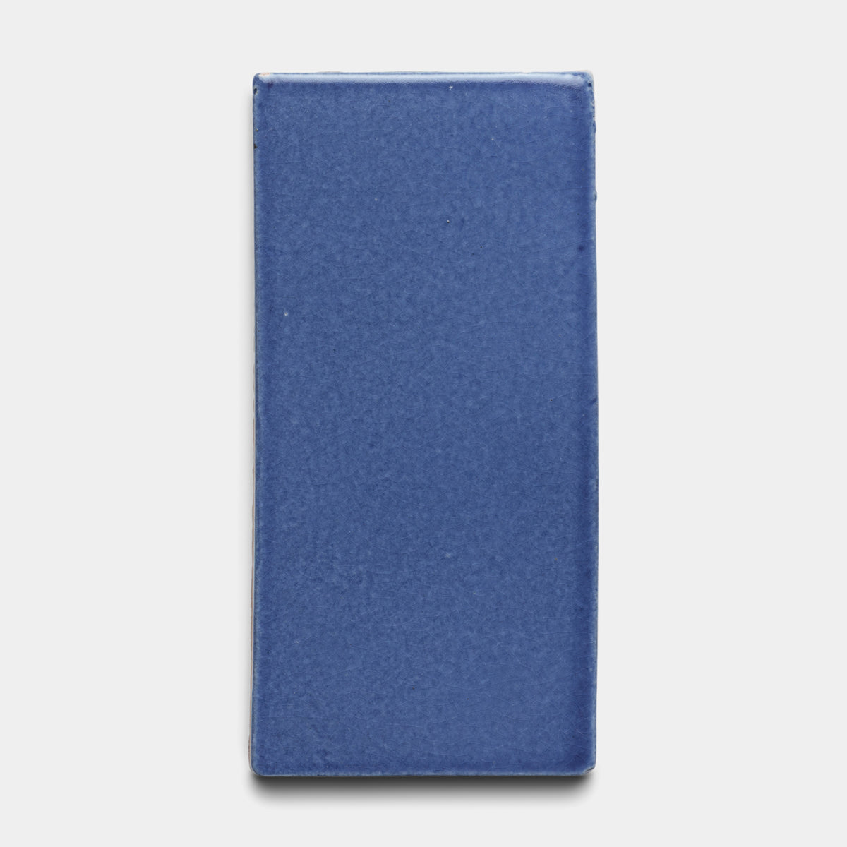 The Zia Tile Azul 4x8 Rectangle is a glossy ceramic tile in solid deep blue, shown against a plain white background.