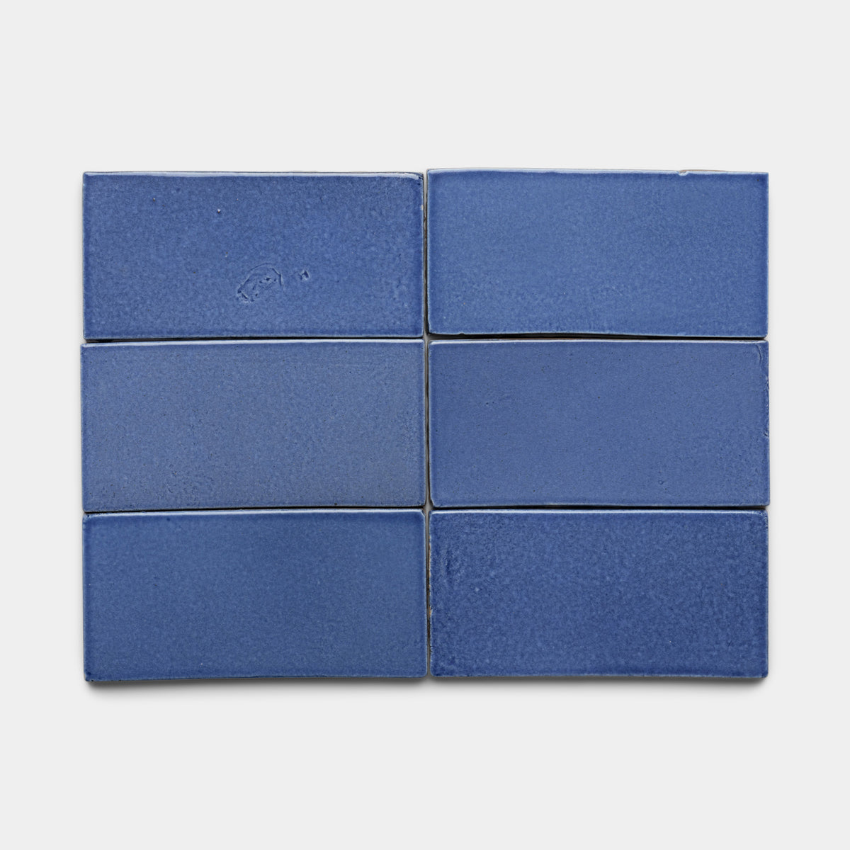 Six Azul 4x8 Rectangle tiles by Zia Tile, rectangular and blue, are arranged in two rows of three on a plain white background.