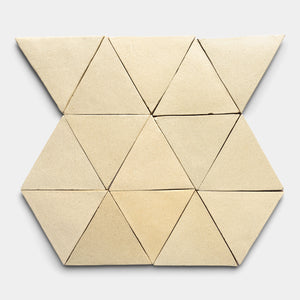 The Baja Triangle by Zia Tile features ten beige triangular tiles arranged symmetrically on a light gray background, creating a striking geometric pattern with neatly aligned shapes.