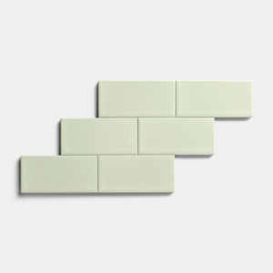 Five Balsam 2x4 rectangular tiles by Zia Tile with a matte finish are arranged in a staggered, brick-like pattern on a plain white background, highlighting their versatility for indoor and outdoor use.