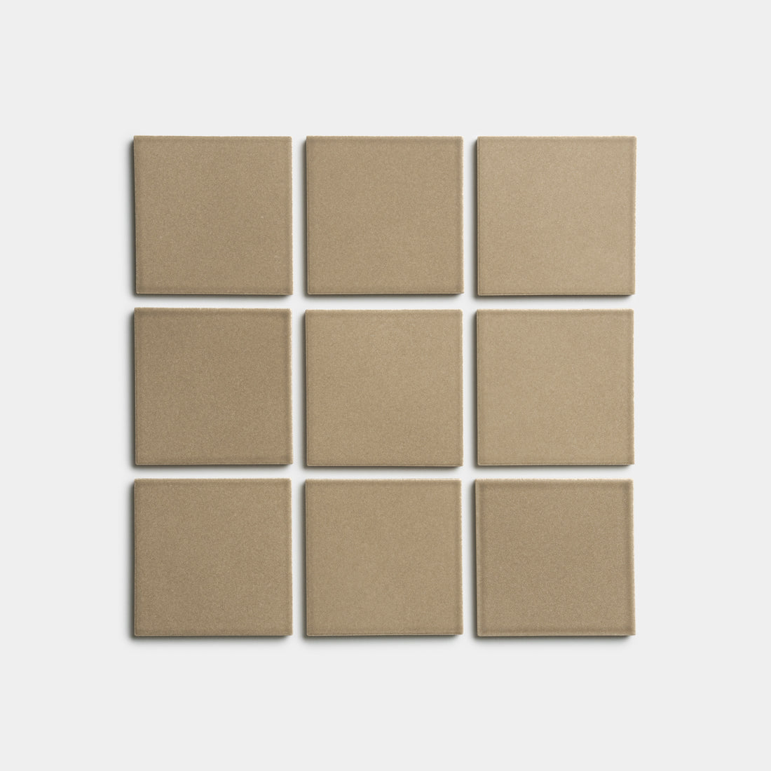 Nine Barley 4x4 matte beige square tiles by Zia Tile, arranged in a three-by-three grid on a white background.