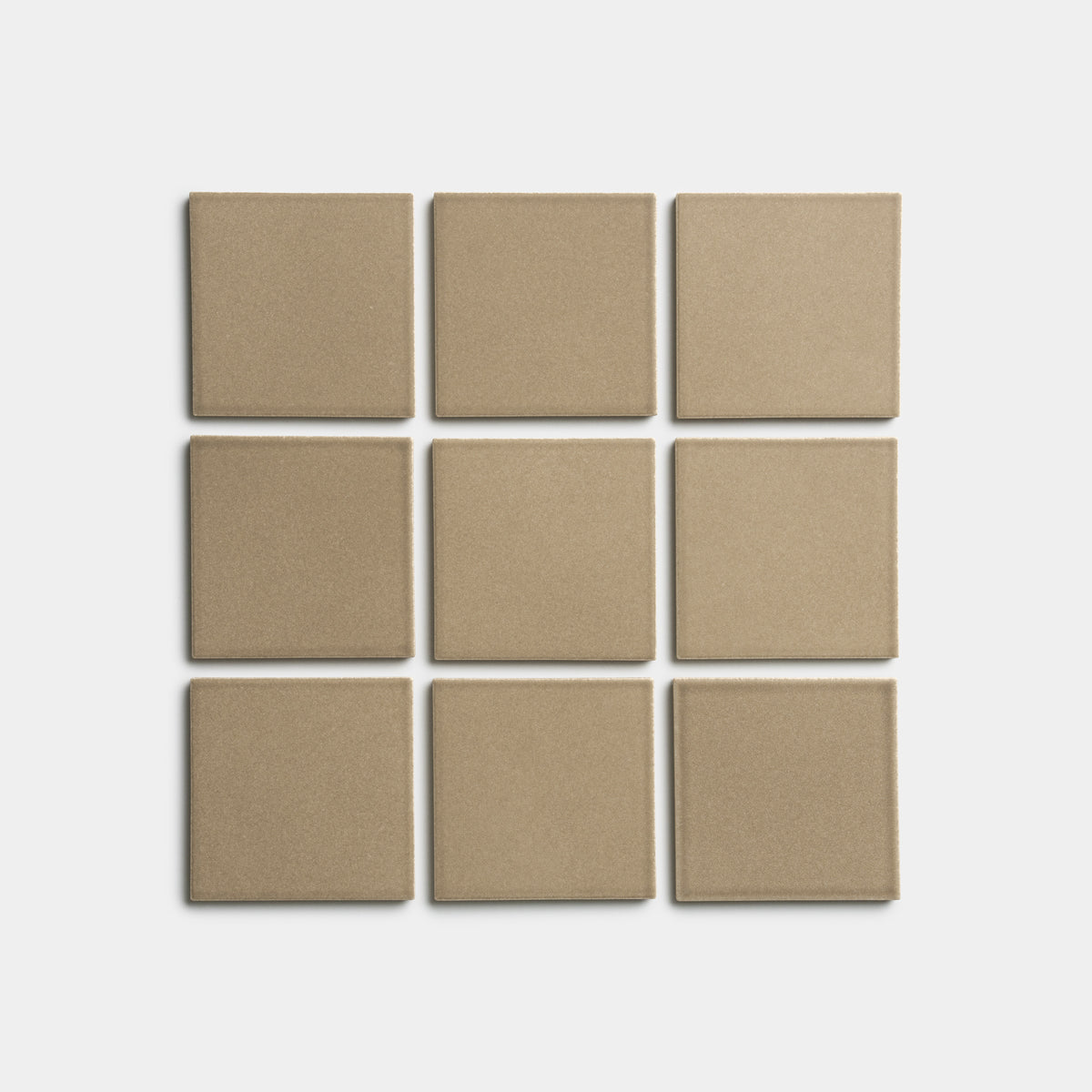 Nine Barley 4x4 matte beige square tiles by Zia Tile, arranged in a three-by-three grid on a white background.