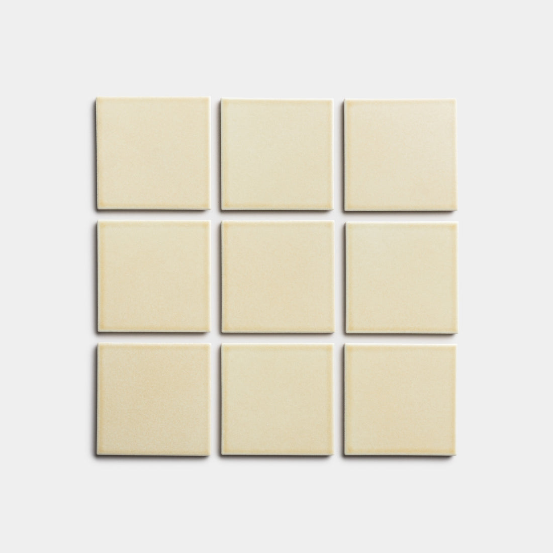 Nine Birch 4x4 tiles by Zia Tile, in a cream color, are arranged in a 3x3 grid on a plain light background.