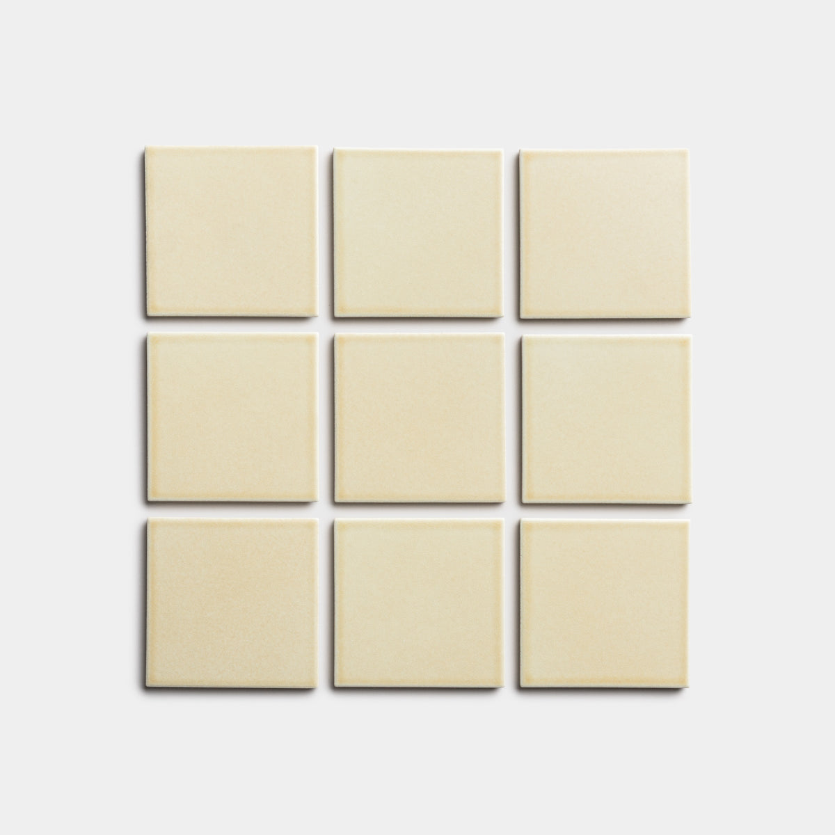 Nine Birch 4x4 tiles by Zia Tile, in a cream color, are arranged in a 3x3 grid on a plain light background.