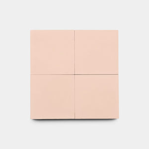 A minimalist, pale pink square cabinet with four panels stands against a white background, reflecting the modern elegance of Zia Tile's Bisbee Pink 4x4 tiles, often chosen for chic kitchen backsplashes.