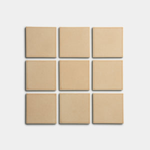Nine Biscuit 4x4 square tiles by Zia Tile, in beige, arranged in a 3x3 grid on a plain white background.