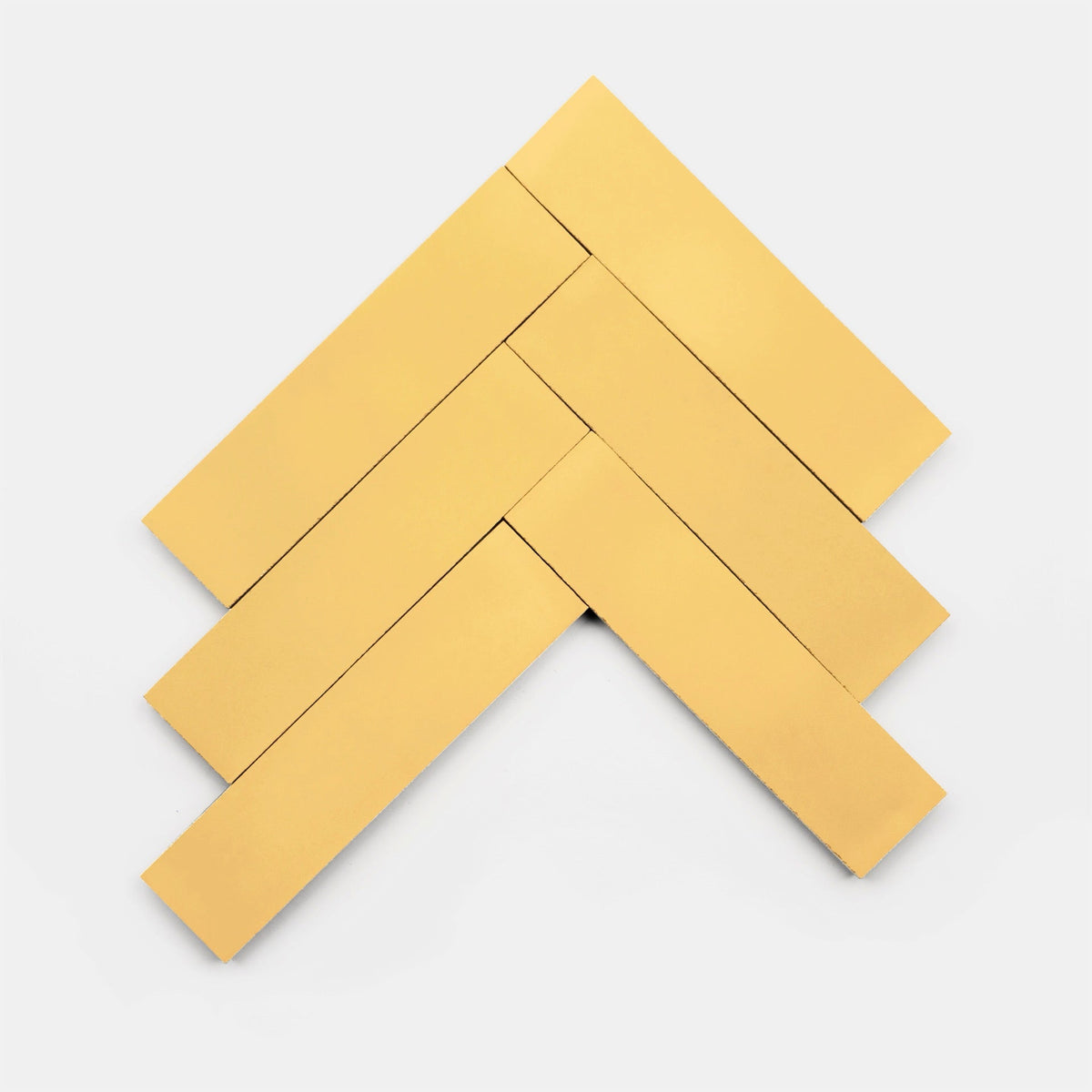 Five blonde 4x4 tiles by vendor-unknown are arranged in a chevron pattern on a white background, highlighting their handmade-inspired rectangular design.