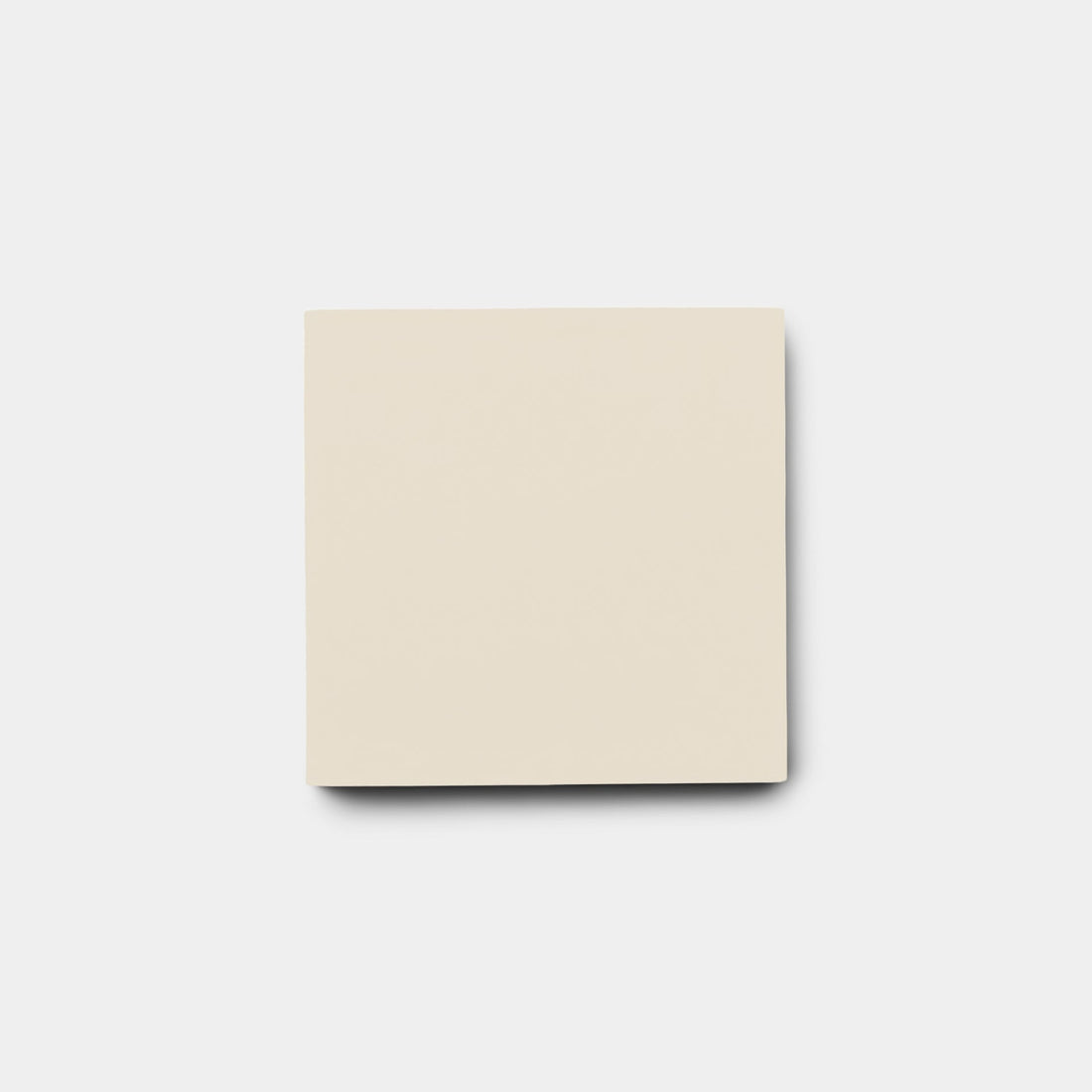 A single, blank, cream-colored sticky note is centered on a light gray background, its subtle hue reminiscent of the Bone 4x4 Sample tile from vendor-unknown.