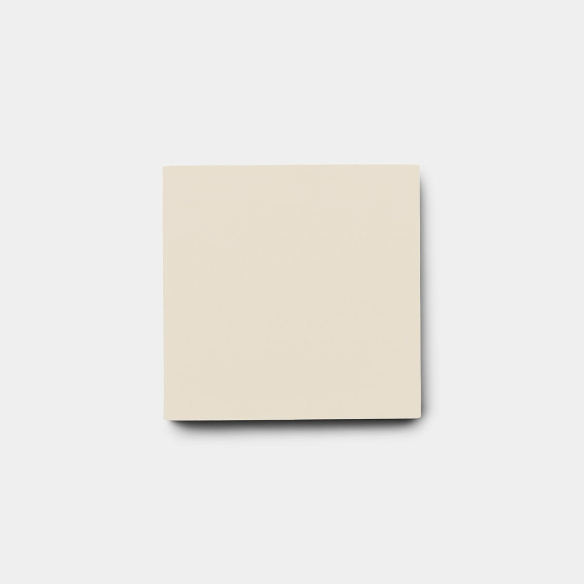 A single, blank, cream-colored sticky note is centered on a light gray background, its subtle hue reminiscent of the Bone 4x4 Sample tile from vendor-unknown.