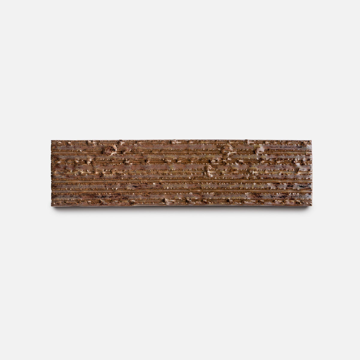 The Buckeye + Furrowed, Sample by Zia Tile features a rectangular shape with a textured surface and horizontal parallel grooves, displayed against a plain white background.
