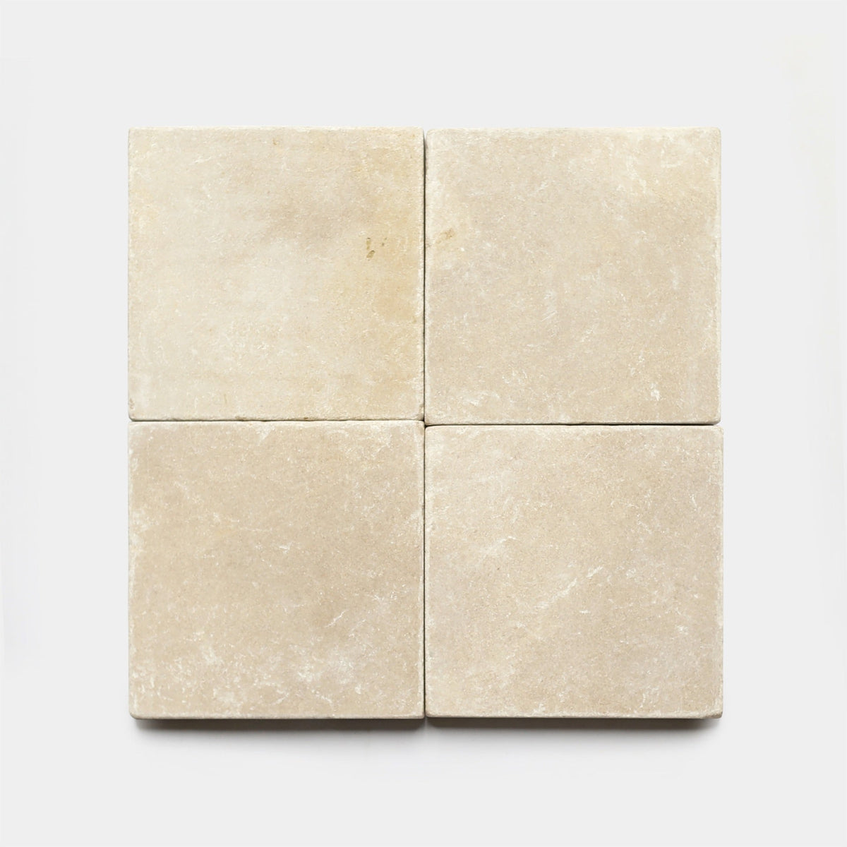 Four Buff 6x6 + Honed sample tiles from Zia Tile, arranged in a 2x2 grid on a white background. Each beige tile features a slightly textured, matte finish—ideal for those seeking Zia Tile's signature cement tile look.