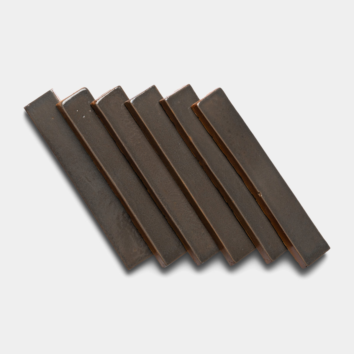 Six Cacao Mini Bars by Zia Tile are arranged diagonally in a neat row on a light gray background.