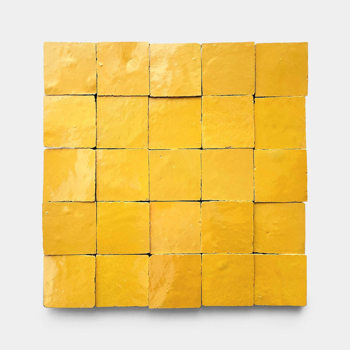 A 5x5 grid of Cadmium 2x6 samples by Zia Tile, arranged in a square pattern on a plain light gray background.
