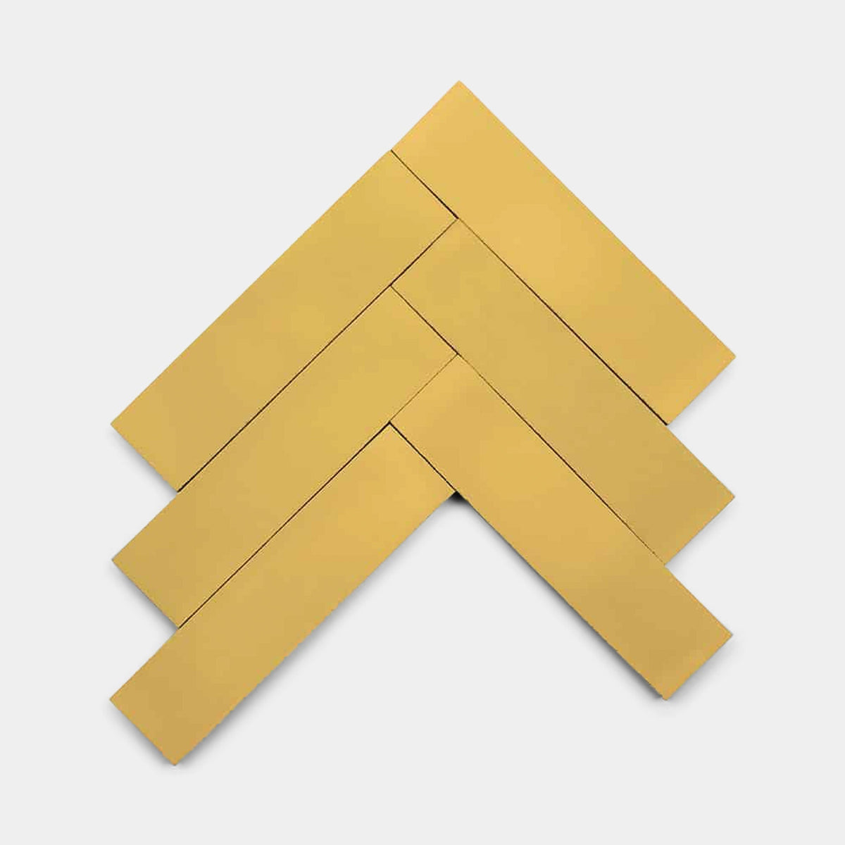 Five rectangular Cadmium 2x6 sample tiles by Zia Tile are arranged in a chevron pattern on a white background, with overlapping angles creating a striking geometric effect.