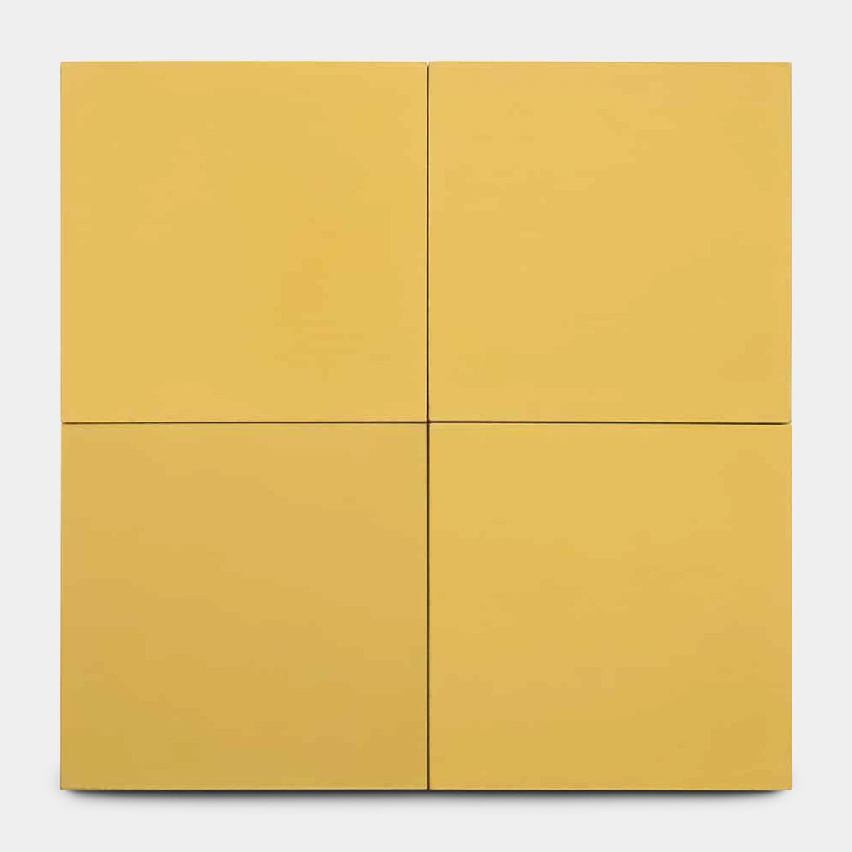The Cadmium 2x6, Sample by Zia Tile features four equal-sized yellow panels in a 2x2 grid with slim gaps, evoking handmade tile design, set against a plain white background.