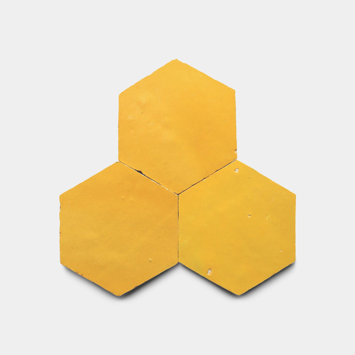 Three Cadmium 2x6 tiles by Zia Tile are arranged edge-to-edge in a honeycomb-like pattern on a plain white background.