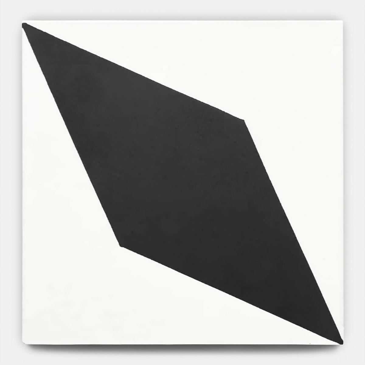 The Cairo White + Black 8x8 tile sample by vendor-unknown features a bold, irregular black diamond set diagonally on a crisp white canvas, with sharp edges and clean lines evoking the look of handmade tile.