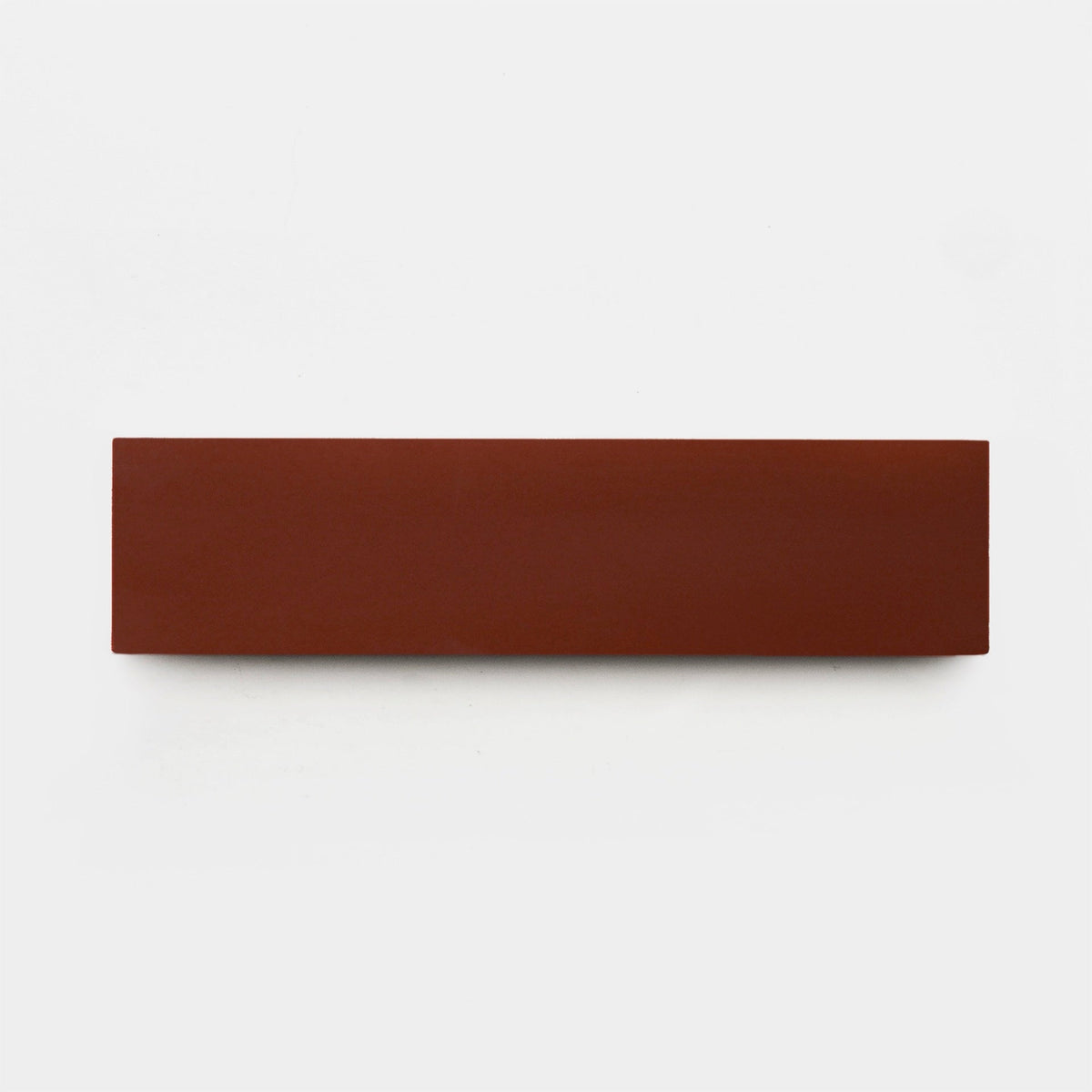 A single Canyon 2x8, Sample tile by vendor-unknown, rectangular and reddish-brown, is centered on a plain white background.