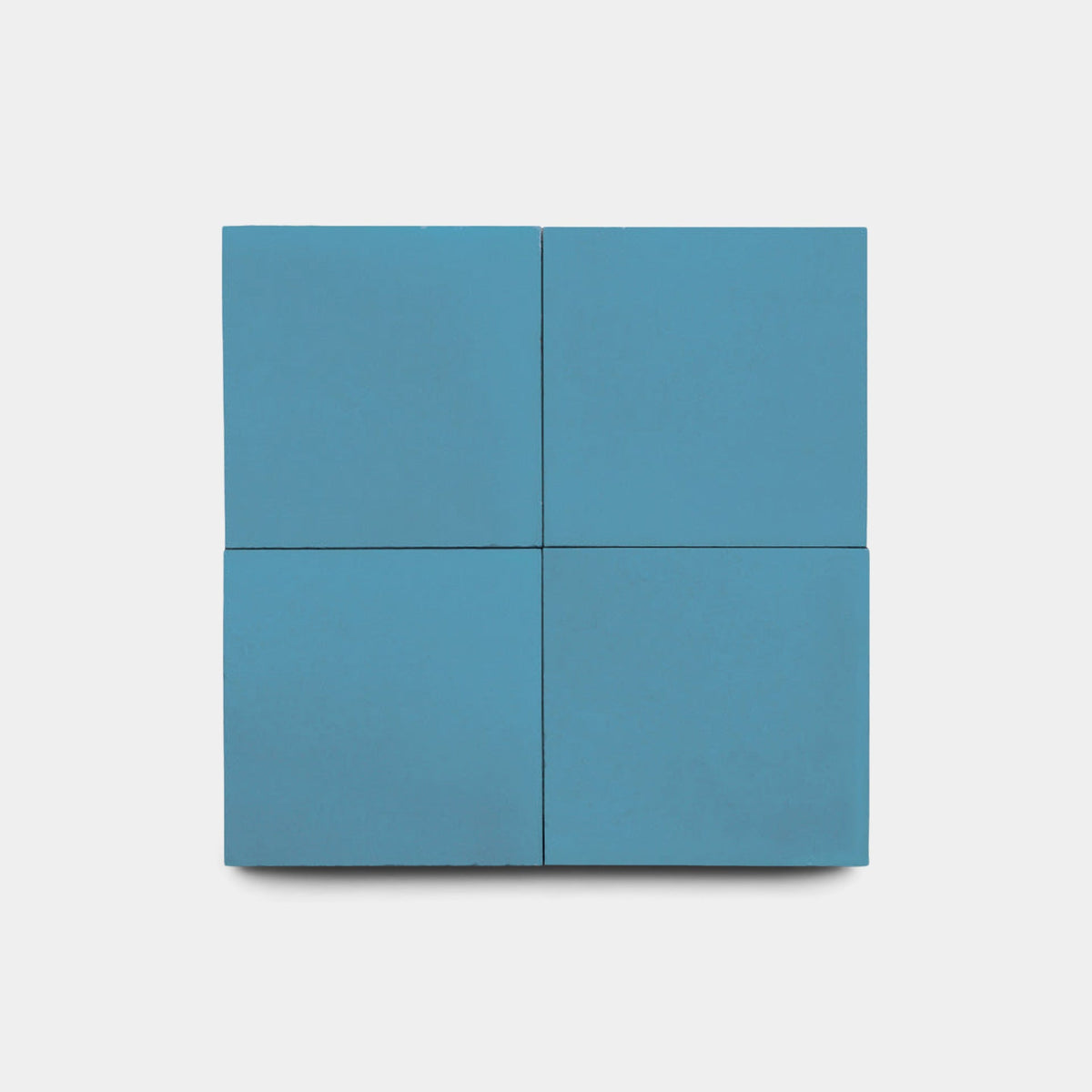 The Carolina Blue 8x8 Sample by vendor-unknown features a minimalist blue square, split into four equal sections by subtle lines, set against a plain white background.
