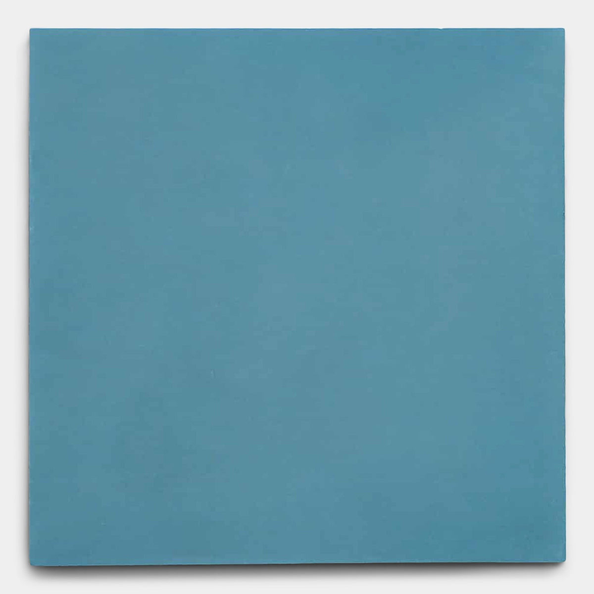The Carolina Blue 4x4 sample tile by vendor-unknown features a matte, plain square design in smooth blue, shown on a light gray background.