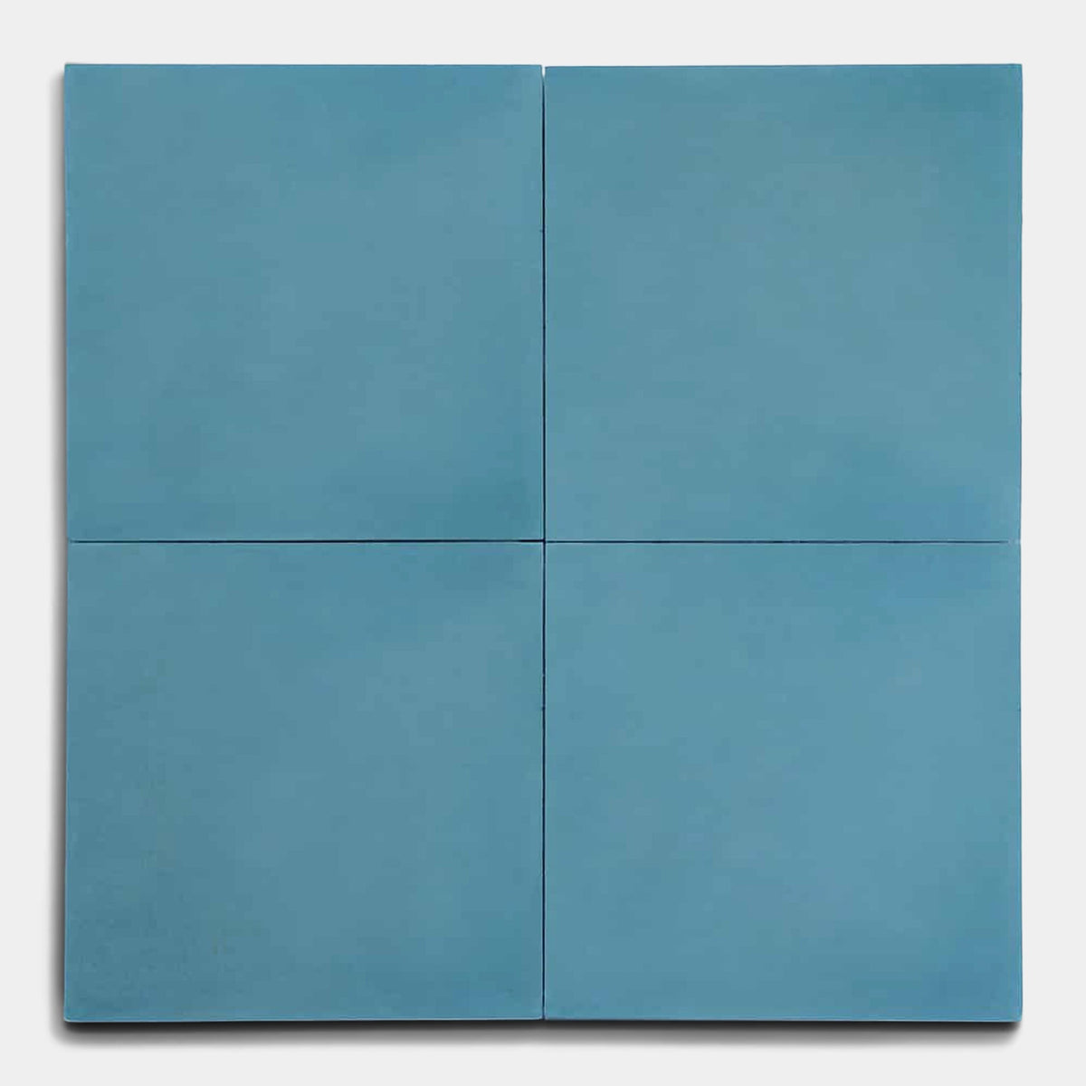 Four Carolina Blue 4x4 matte handmade tiles from vendor-unknown are arranged in a 2x2 grid on a light gray background.