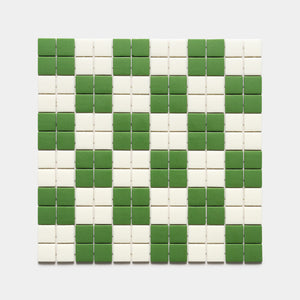 The Zia Tile Cheque Clover + Milk, Sample showcases a square grid of small tiles with a checkered pattern of alternating green and white squares, neatly arranged to form diagonal stripes across the surface.