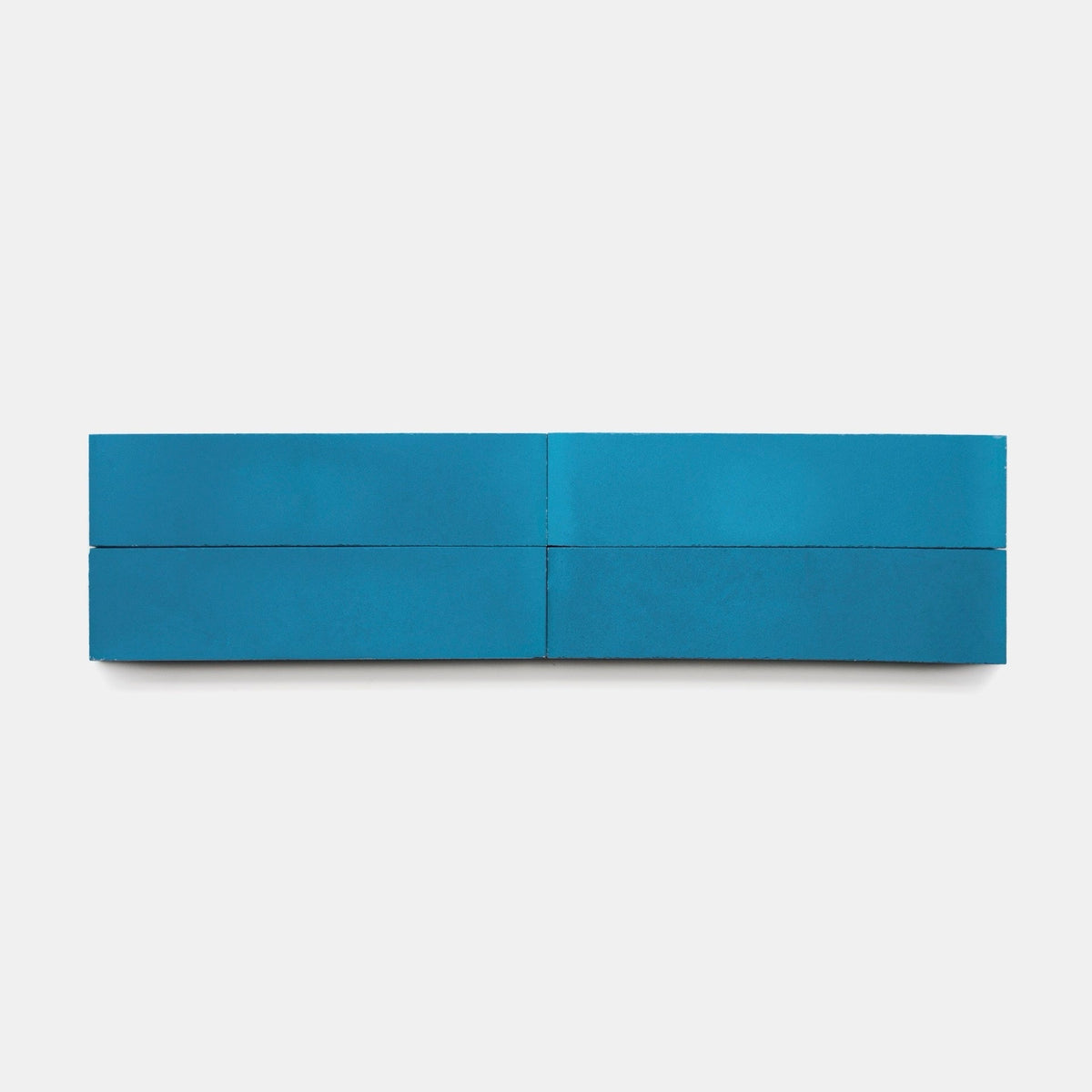 The Cobalt 2x8, Sample by vendor-unknown features four rectangular blue blocks, tile-inspired, arranged horizontally on a plain white background for a minimalist look.