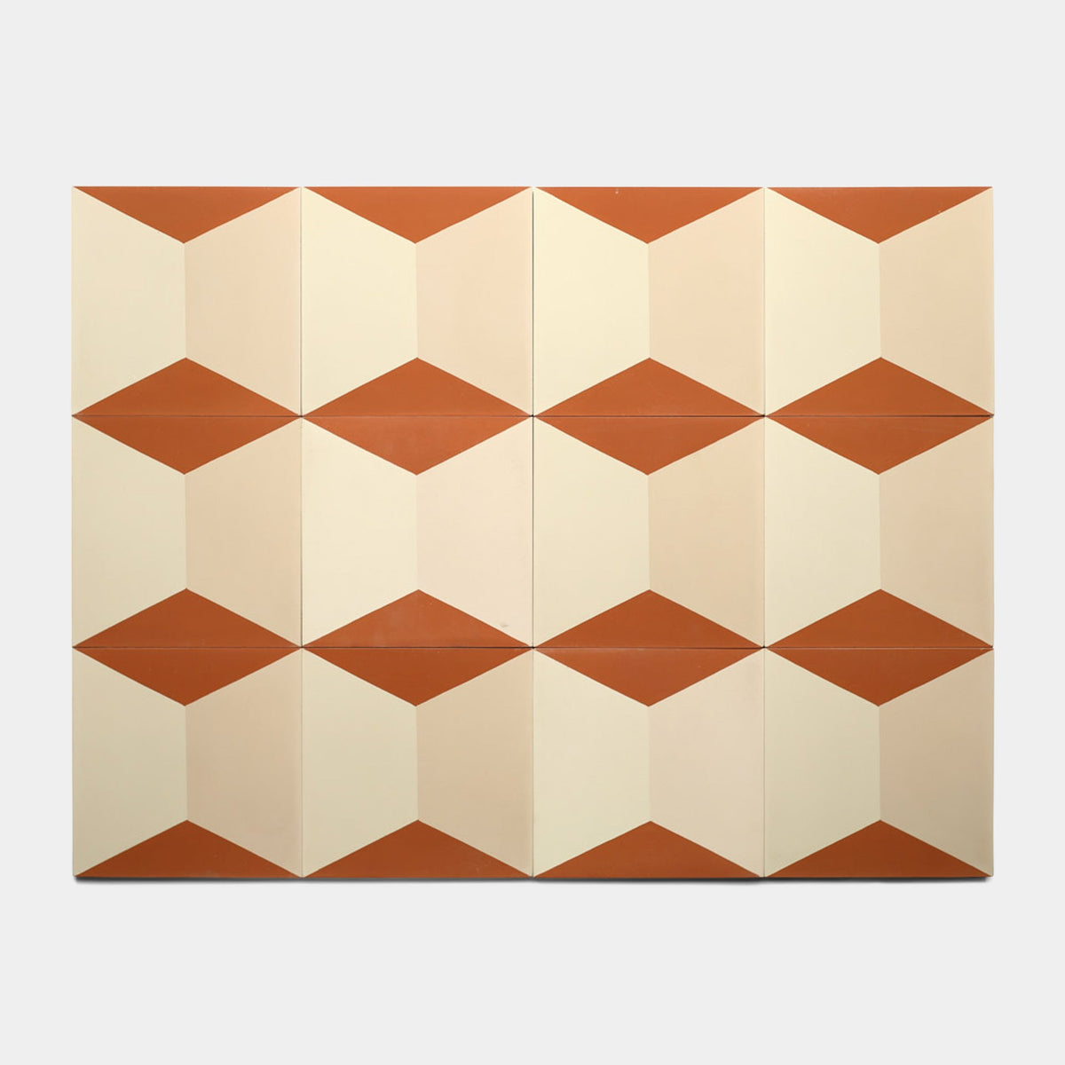 Zia Tile's Colorama Dune 8x8 Sample tiles create a repeating cube pattern in beige, cream, and terracotta tones, arranged in a grid on a light background.
