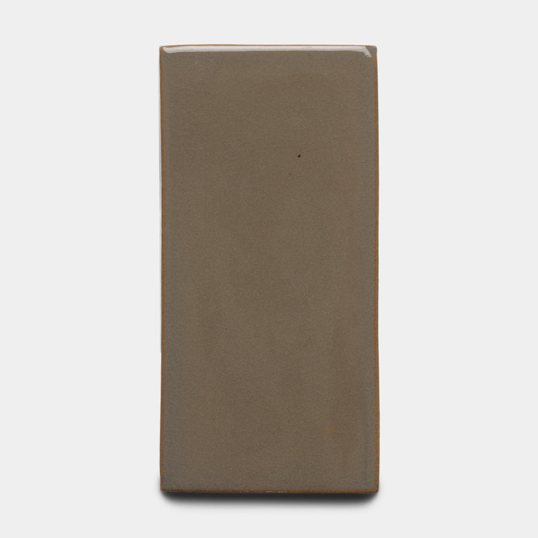 The Zia Tile Condesa 4x8 Rectangle is a smooth, matte, brownish-gray ceramic tile with a solid color, displayed on a plain white background.