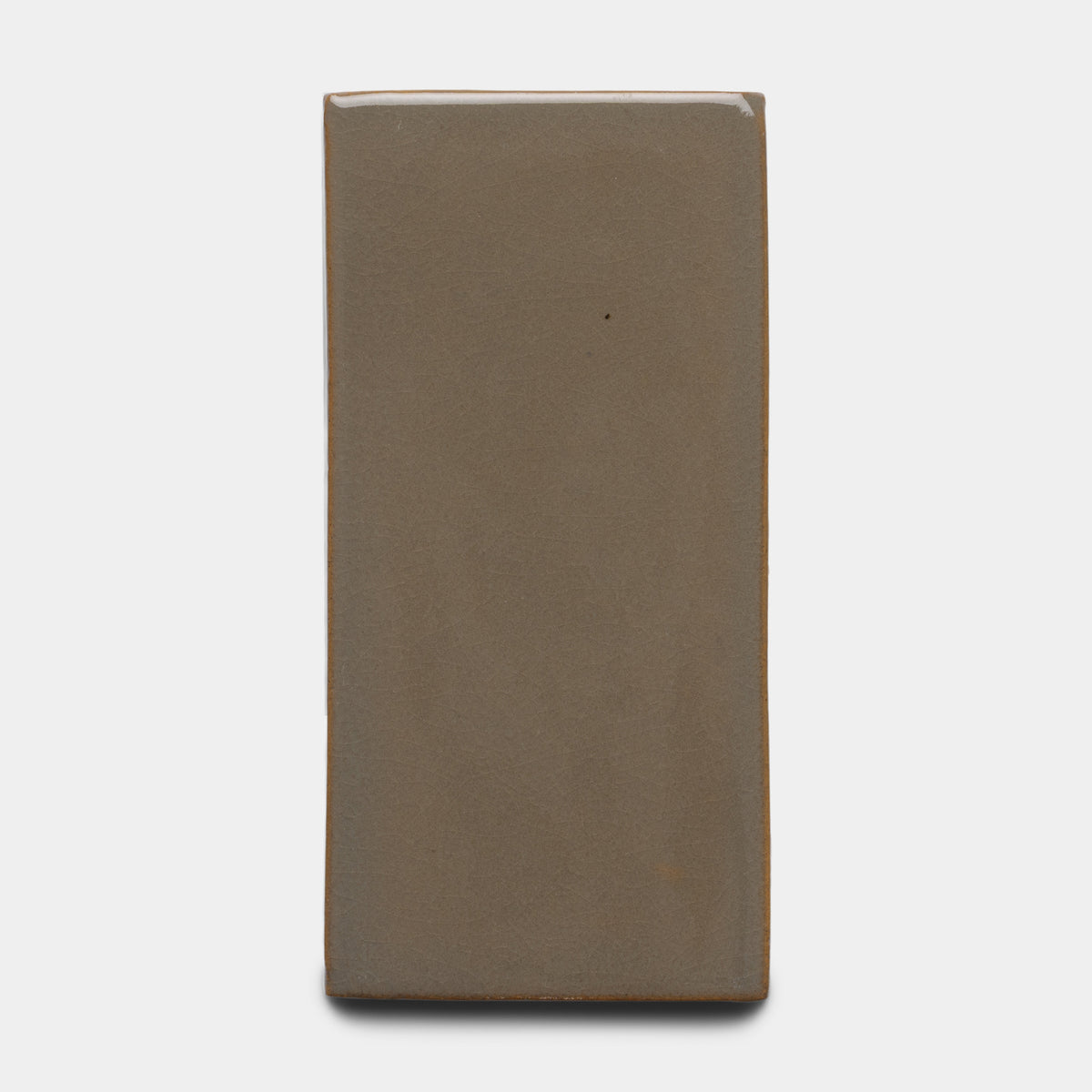 The Zia Tile Condesa 4x8 Rectangle is a smooth, matte, brownish-gray ceramic tile with a solid color, displayed on a plain white background.