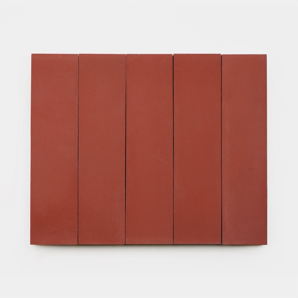 Five vertical, evenly spaced, rectangular Coral 2x8 tiles by vendor-unknown are displayed side by side on a plain white background, highlighting the striking simplicity of handmade tile craftsmanship.