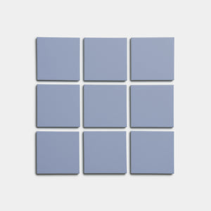Nine Cornflower 4x4 tiles by Zia Tile, light blue and square, are arranged in a 3x3 grid on a plain white background.