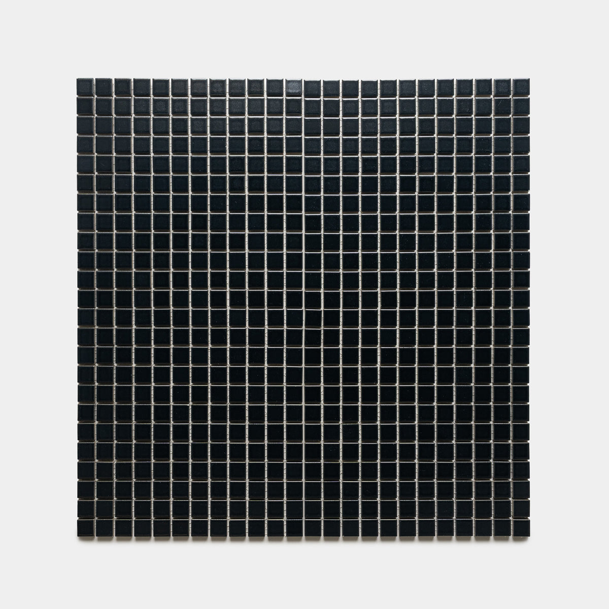 A square grid of Zia Tile’s Cosmic Black 1x1 tiles, small and evenly spaced with thin white grout lines, displayed on a plain white background.