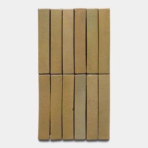 Twelve Creosote Mini Bar tiles by Zia Tile are arranged in a vertical grid of three columns and four rows against a plain white background.