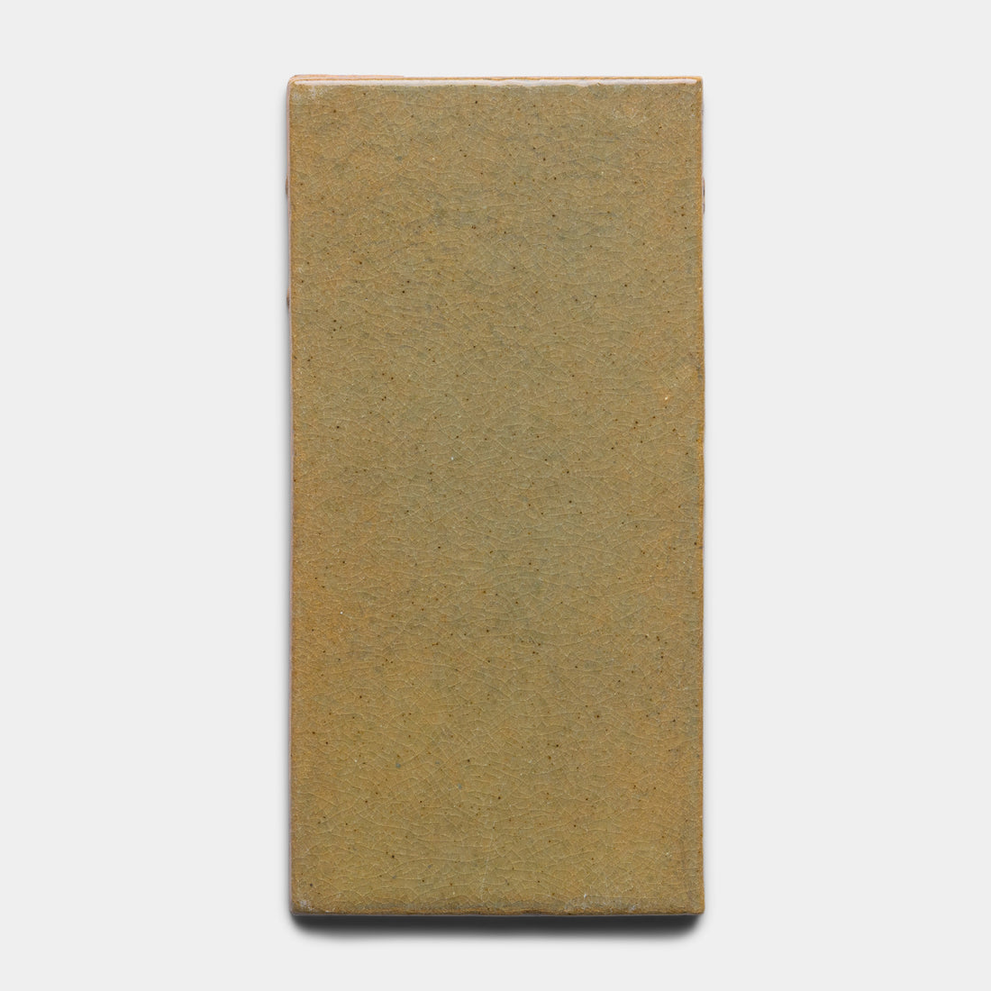 The Creosote 4x8 Rectangle by Zia Tile is a tan, rectangular ceramic tile with slightly rounded edges, displayed on a plain white background.