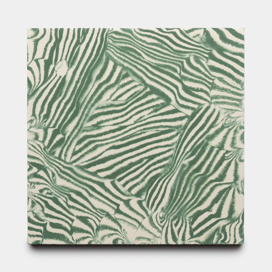 The Currents Noblen Green + Bone 8x8 sample by Zia Tile showcases an abstract, zebra-inspired pattern in green and white, creating a bold, organic texture across the canvas.